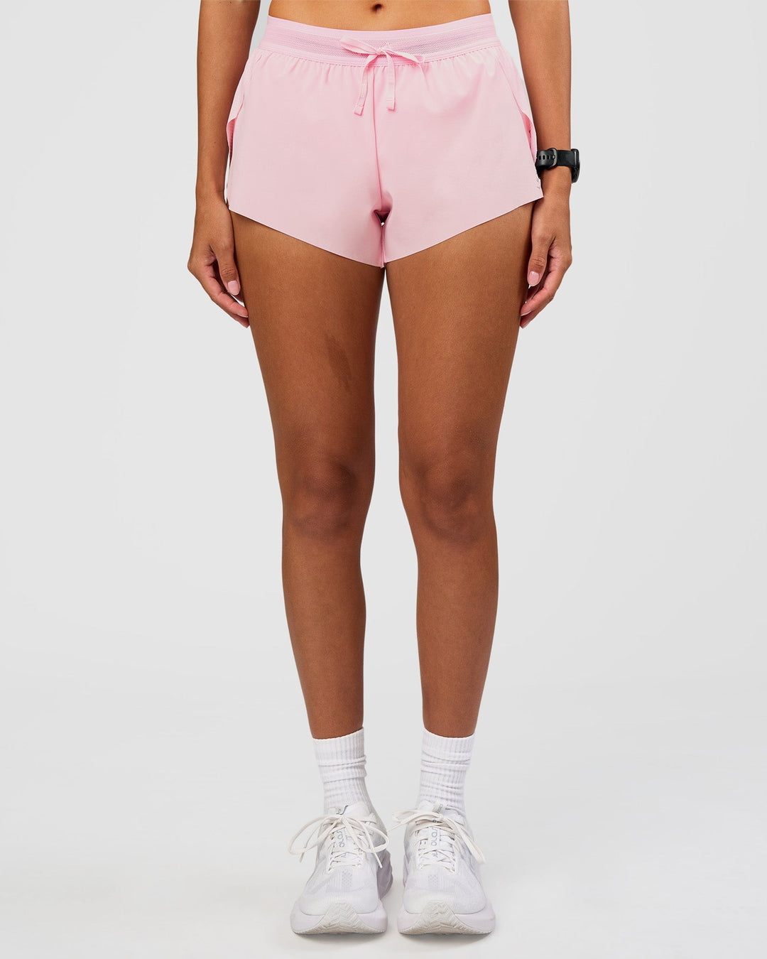 Woman wearing Accelerate 3" Mid-Rise Running Short - Marshmallow | Set:true | Angle:front | Model:Rhiley | Size:S