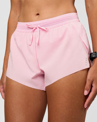 Woman wearing Accelerate 3" Mid-Rise Running Short - Marshmallow | Set:true | Angle:closeup | Model:Rhiley | Size:S