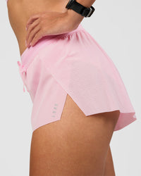Woman wearing Accelerate 3" Mid-Rise Running Short - Marshmallow | Model:Rhiley | Size:S
