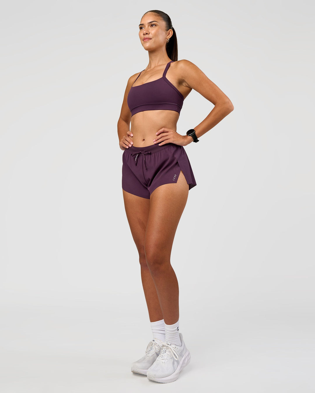 Woman wearing Accelerate 3" Mid-Rise Running Short - Midnight Plum | Model:Rhiley | Size:S