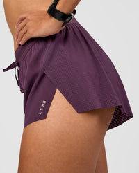 Woman wearing Accelerate 3" Mid-Rise Running Short - Midnight Plum | Model:Rhiley | Size:S
