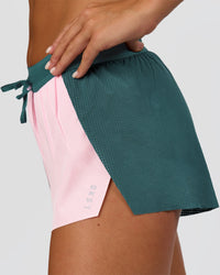 Woman wearing Accelerate 3" Mid-Rise Running Short - Transformative Teal-Marshmallow | Model:Amity | Size:S