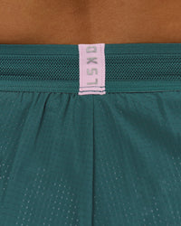 Woman wearing Accelerate 3" Mid-Rise Running Short - Transformative Teal-Marshmallow | Model:Amity | Size:S