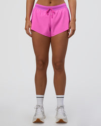 Woman wearing Accelerate 3" Mid-Rise Running Short - Ultra Fuchsia | Set:true | Angle:front | Model:Amity | Size:S