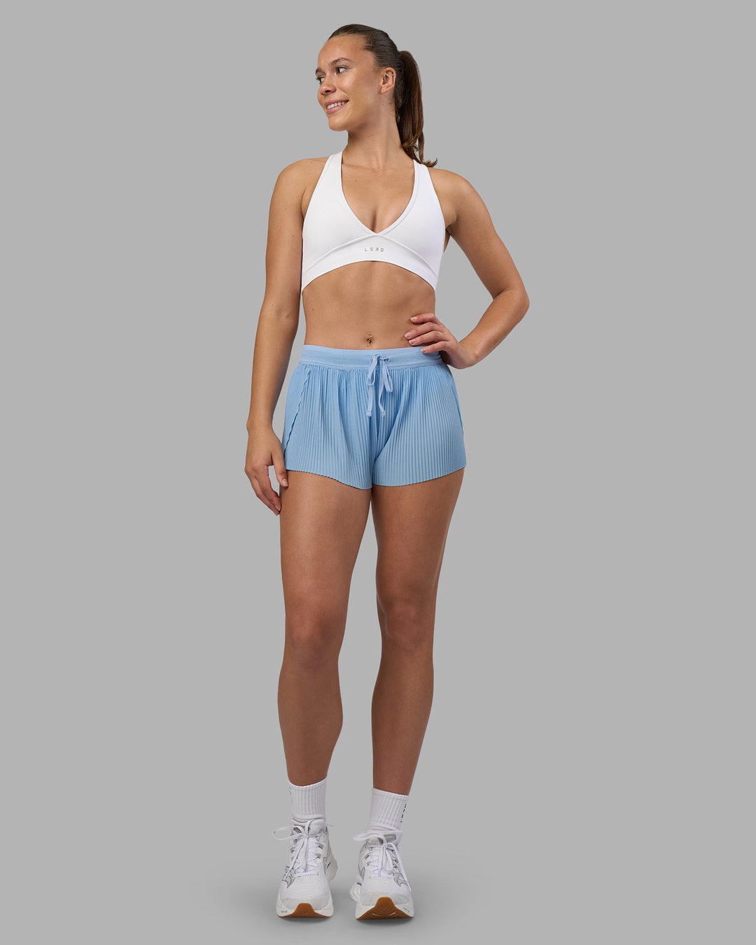 Woman wearing Accelerate 3&quot; Pleated Running Short - Open Air | Model:Charlize | Size:S
