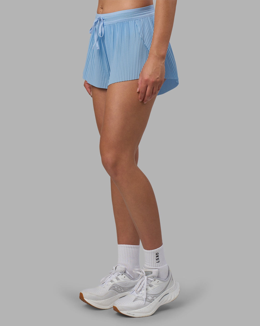 Woman wearing Accelerate 3&quot; Pleated Running Short - Open Air | Model:Charlize | Size:S