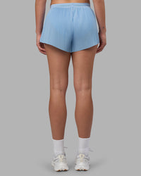 Woman wearing Accelerate 3" Pleated Running Short - Open Air | Model:Charlize | Size:S