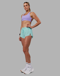 Woman wearing Accelerate 3" Running Short - Island Paradise | Model:Shae | Size:S