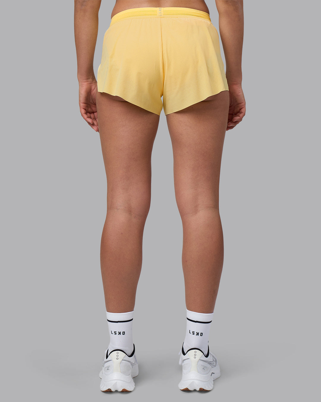 Woman wearing Accelerate 3&quot; Running Short - Lemon | Model:Sophie | Size:S