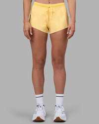 Woman wearing Accelerate 3" Running Short - Lemon | Set:true | Angle:front | Model:Sophie | Size:S
