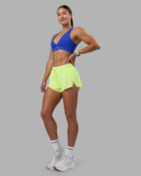 Woman wearing Accelerate 3" Running Short - Lime Glo | Model:Hannah | Size:S