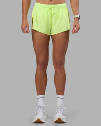 Woman wearing Accelerate 3" Running Short - Lime Glo | Set:true | Angle:front | Model:Hannah | Size:S
