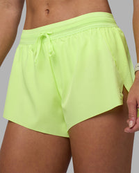 Woman wearing Accelerate 3" Running Short - Lime Glo | Set:true | Angle:closeup | Model:Hannah | Size:S