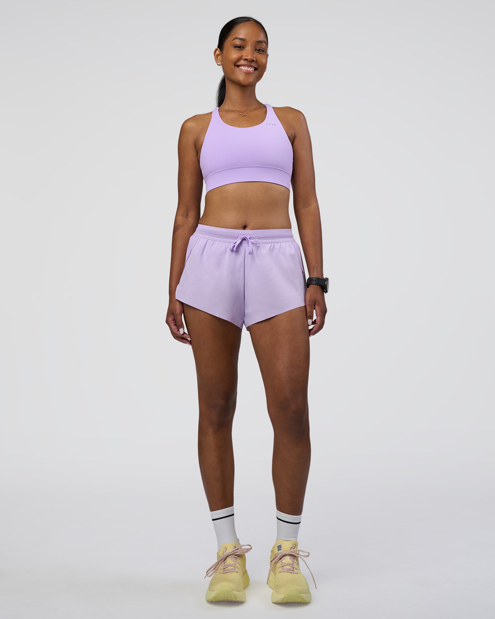 Woman wearing Accelerate 3" Running Short - Pale Lilac | Model:Rica | Size:S