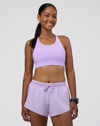 Woman wearing Accelerate 3" Running Short - Pale Lilac | Model:Rica | Size:S