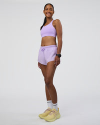 Woman wearing Accelerate 3" Running Short - Pale Lilac | Model:Rica | Size:S