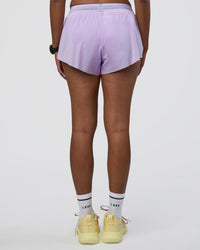 Woman wearing Accelerate 3" Running Short - Pale Lilac | Set:true | Angle:back | Model:Rica | Size:S