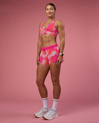 Woman wearing Accelerate 3" Running Short - Pink Glow Print | Model:Hannah | Size:S