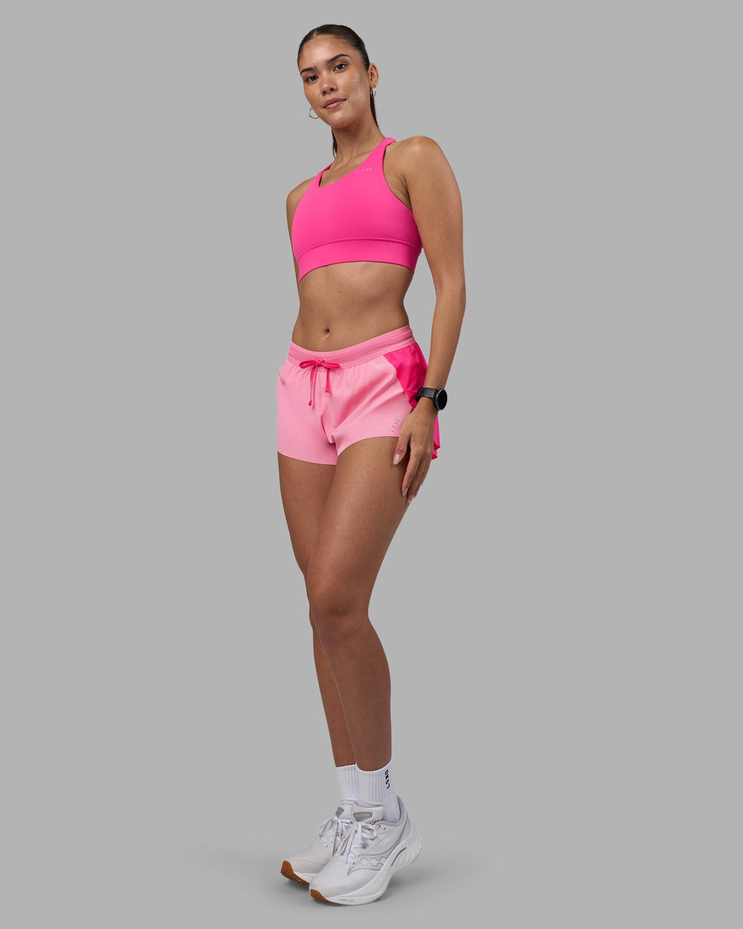 Woman wearing Accelerate 3&quot; Running Short - Ultra Pink-Candy Pink | Model:Rhiley | Size:S