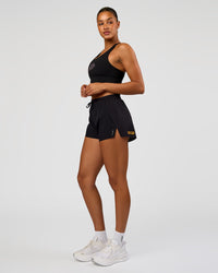 Woman wearing Accelerate Graphic Sports Bra - Black-Radiate | Model:Rosie | Size:S