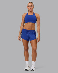 Woman wearing Accelerate 3" Run Short in Power Cobalt | Model:Shalem | Size:S