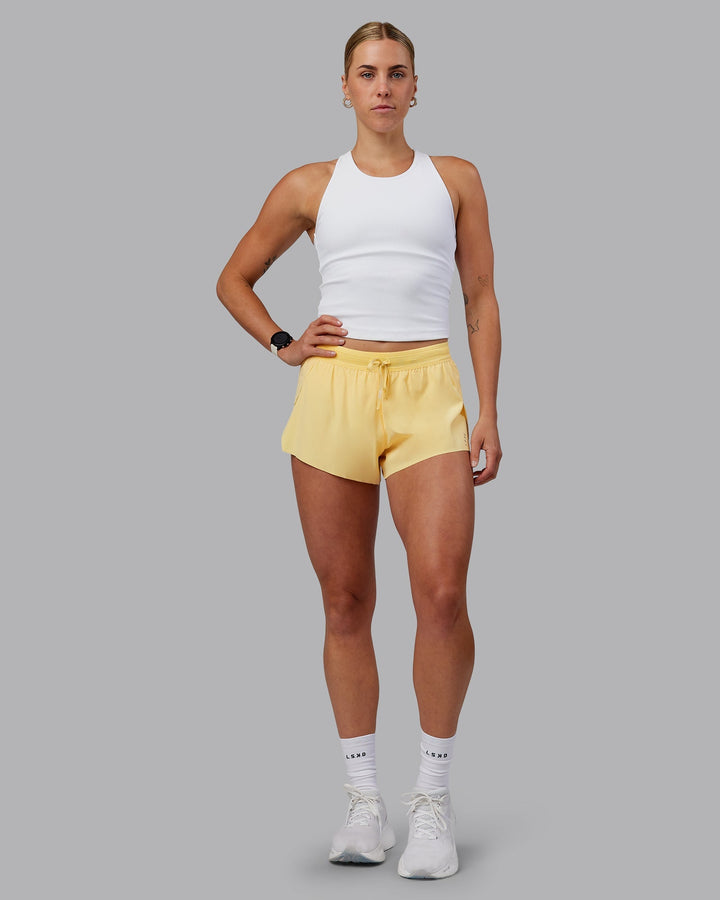 Woman wearing Accelerate 3&quot; Run Shorts - Sunflower
