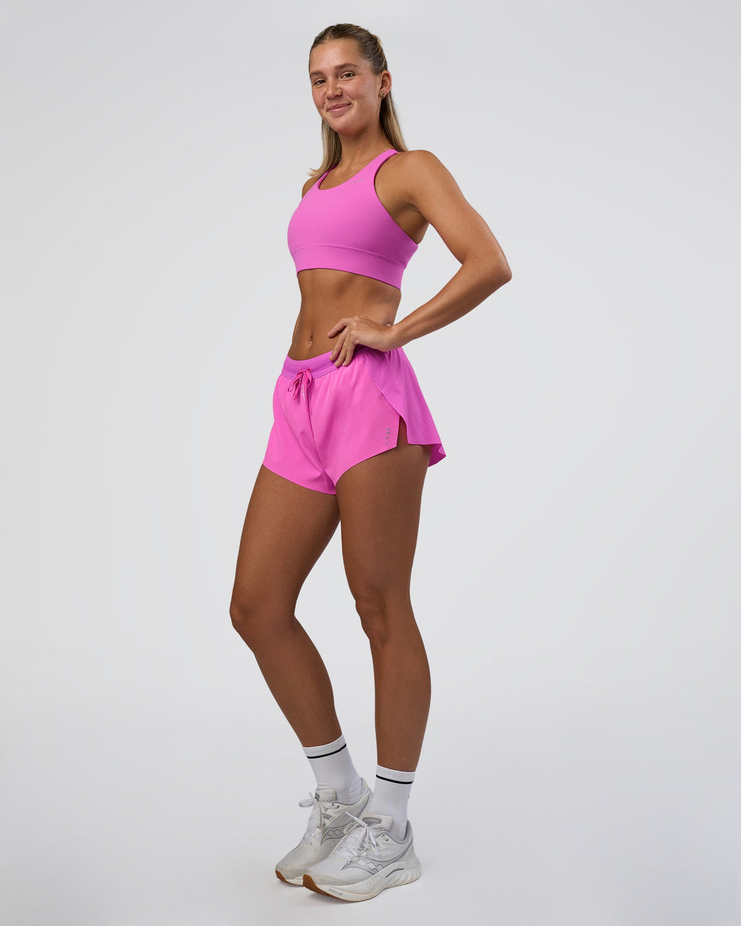 Woman wearing Accelerate Split Strap Sports Bra - Ultra Fuchsia | Model:Amity | Size:S