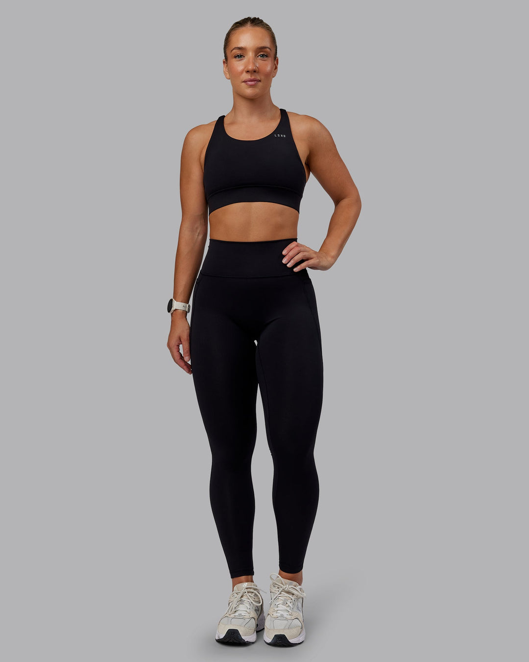 Woman wearing Accelerate Sports Bra in Black | Size:S