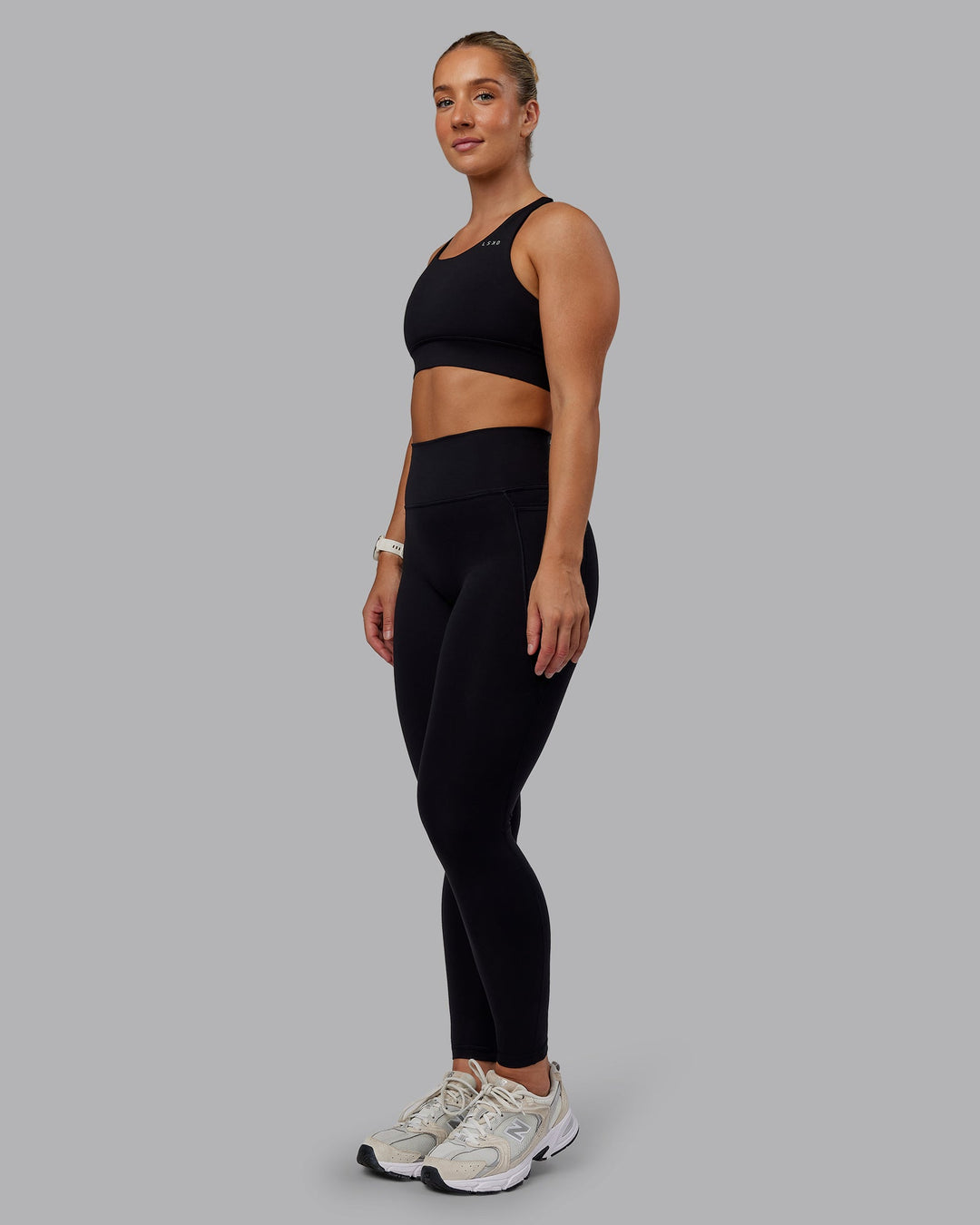 Woman wearing Accelerate Sports Bra in Black | Size:S