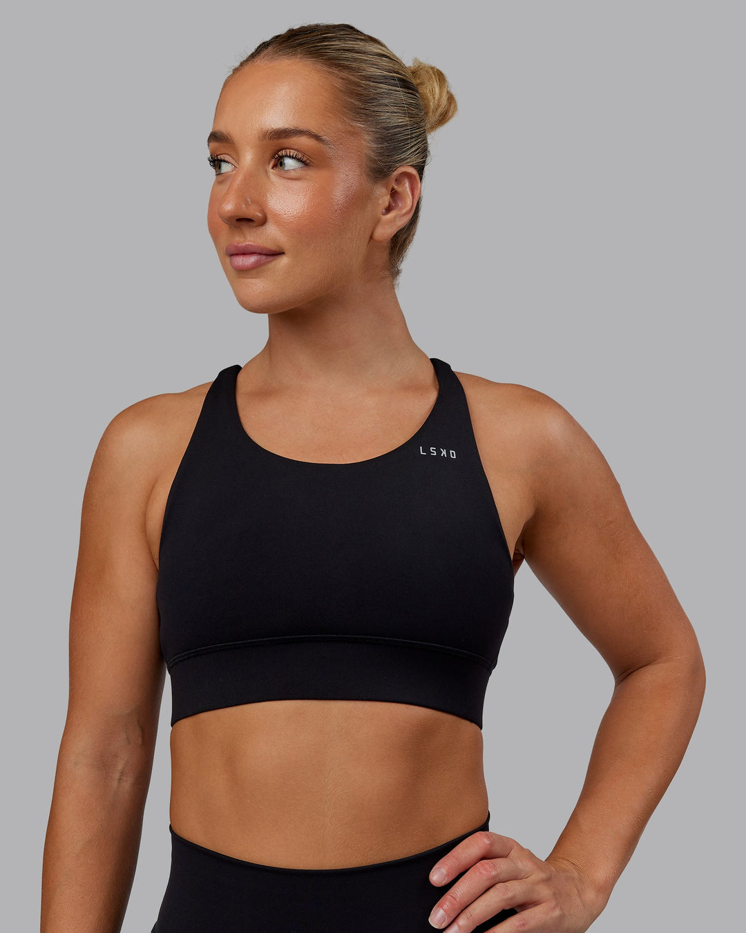 Woman wearing Accelerate Sports Bra in Black | Size:S