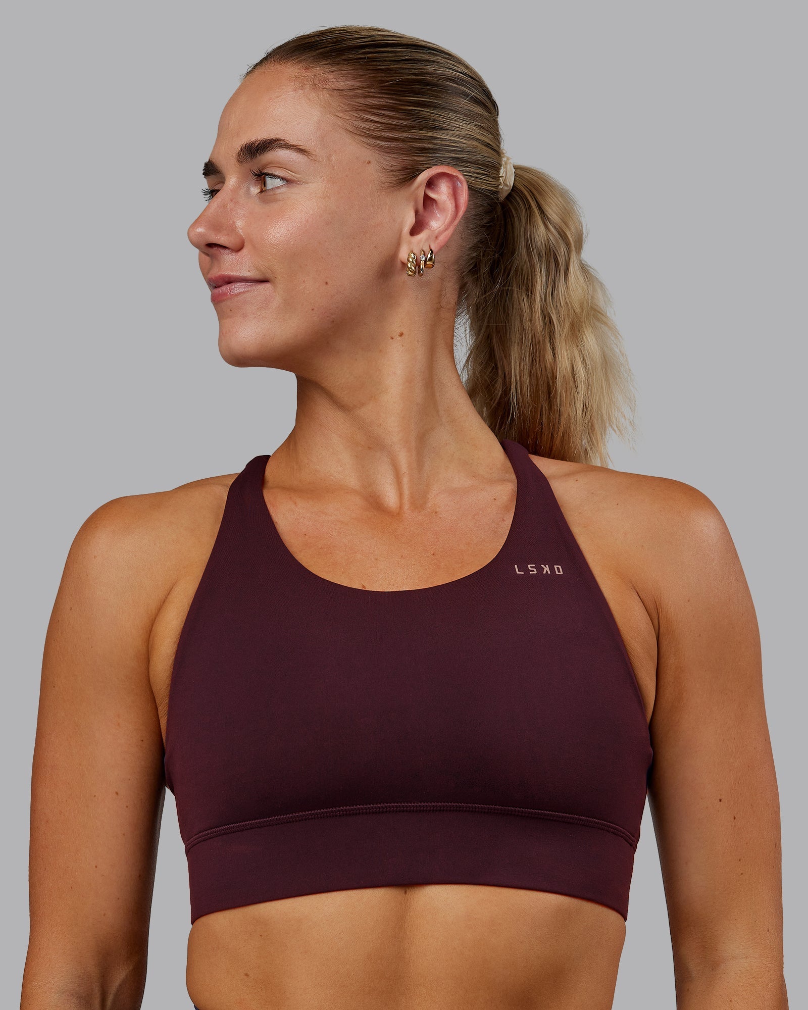 Woman wearing Accelerate Sports Bra - Cherry Lacquer | Model:Hannah | Size:S