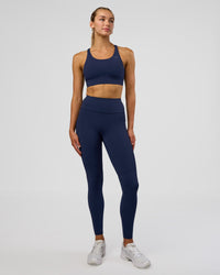 Woman wearing Accelerate Sports Bra - Future Navy | Model:Evie | Size:S