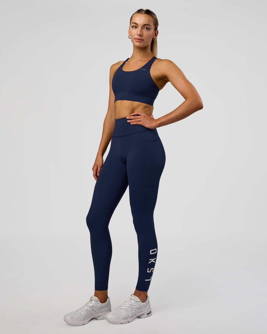 Woman wearing Accelerate Sports Bra - Future Navy | Model:Evie | Size:S