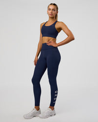 Woman wearing Accelerate Sports Bra - Future Navy | Model:Evie | Size:S