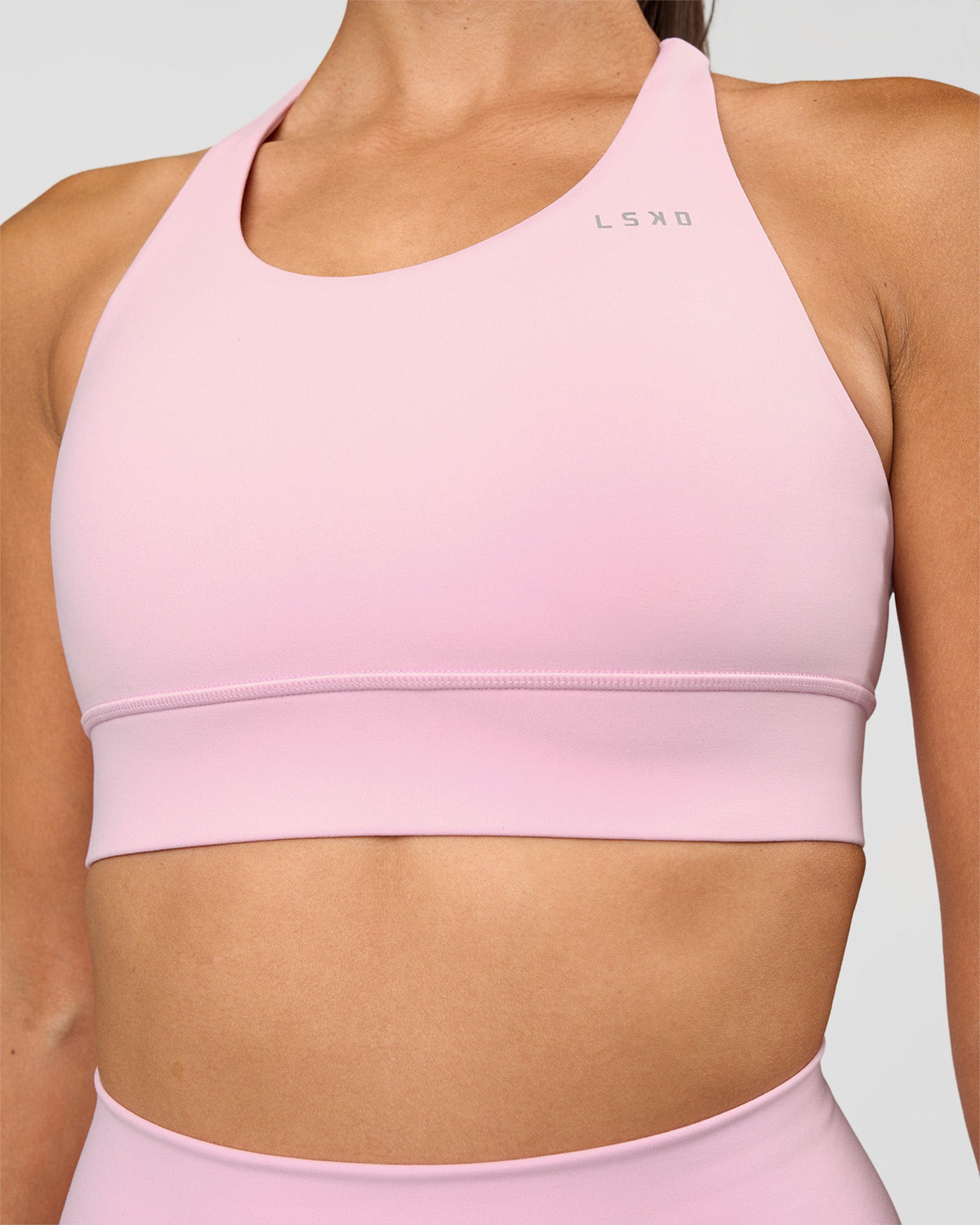 Woman wearing Accelerate Sports Bra - Marshmallow | Set:true | Angle:closeup | Model:Rhiley | Size:S - view 1