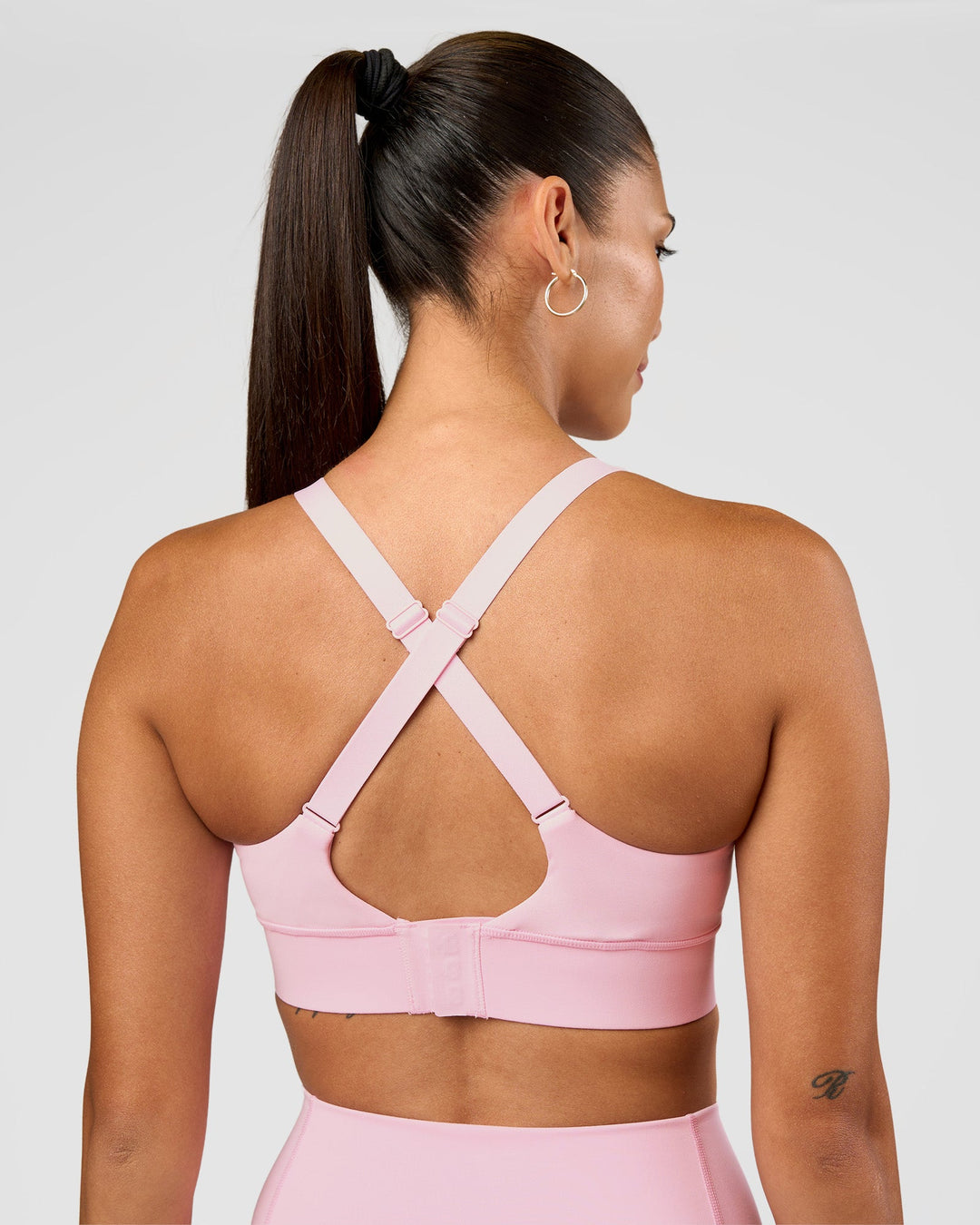 Woman wearing Accelerate Sports Bra - Marshmallow | Set:true | Angle:back | Model:Rhiley | Size:S