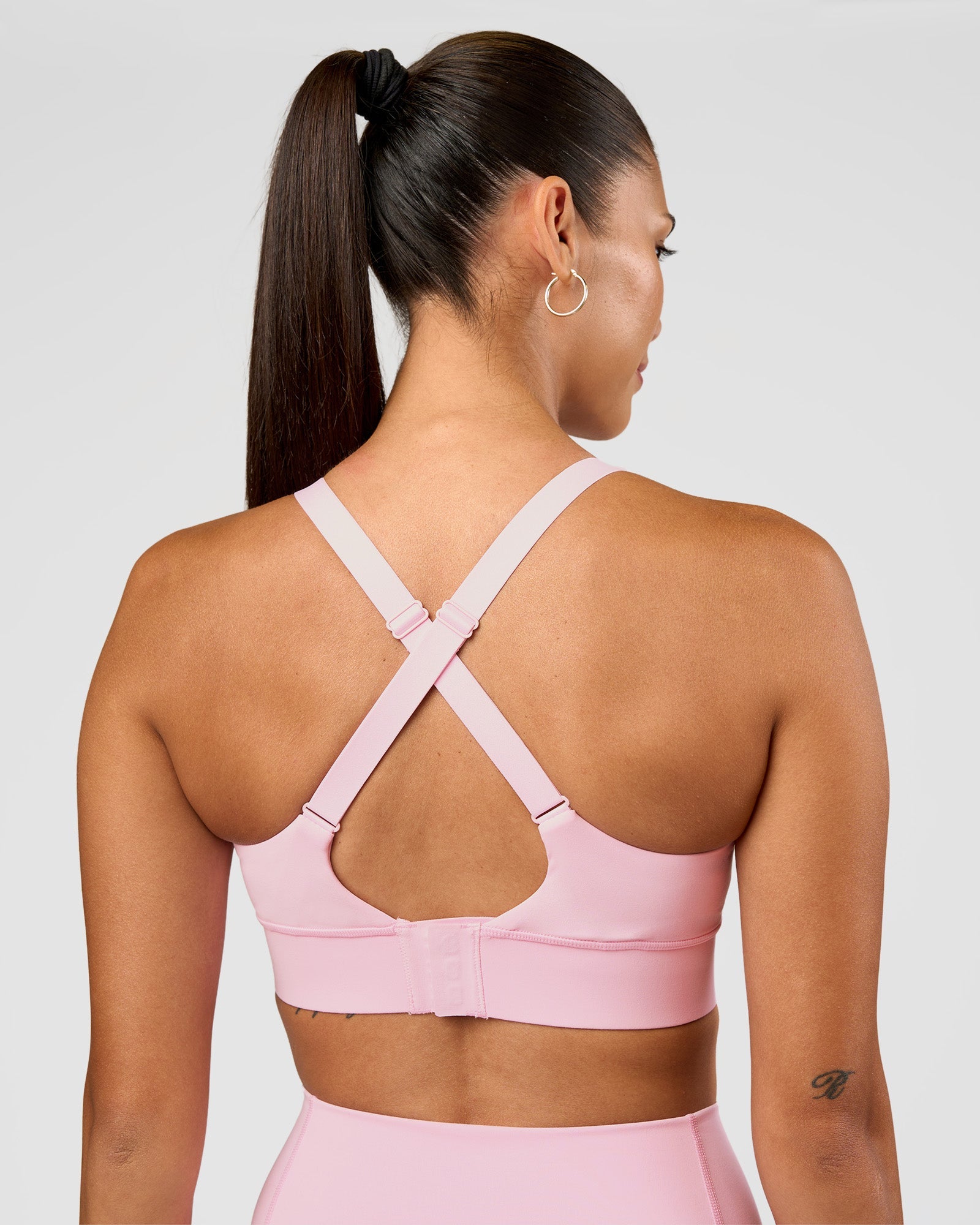 Woman wearing Accelerate Sports Bra - Marshmallow | Set:true | Angle:back | Model:Rhiley | Size:S
