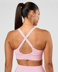 Woman wearing Accelerate Sports Bra - Marshmallow | Set:true | Angle:back | Model:Rhiley | Size:S