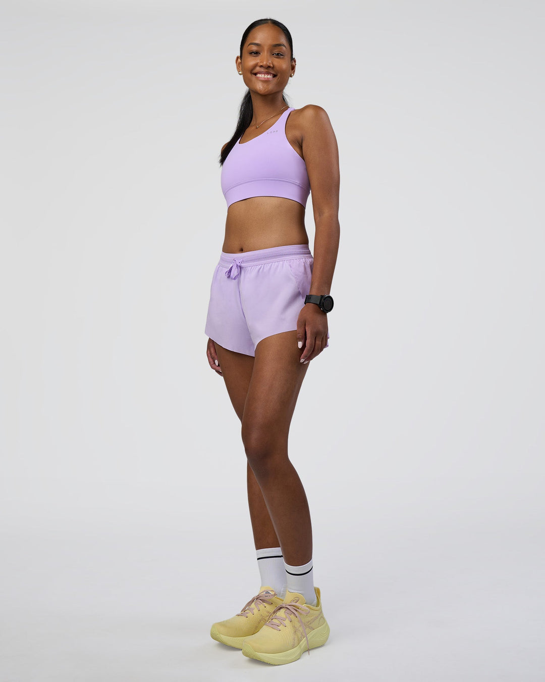 Woman wearing Accelerate Sports Bra - Pale Lilac | Model:Rica | Size:S