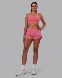 Woman wearing Accelerate Sports Bra in Pink Lemonade | Model:Phoebe | Size:S