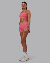 Woman wearing Accelerate Sports Bra in Pink Lemonade | Model:Phoebe | Size:S