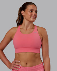 Woman wearing Accelerate Sports Bra in Pink Lemonade | Model:Phoebe | Size:S