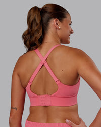 Woman wearing Accelerate Sports Bra in Pink Lemonade | Model:Phoebe | Size:S