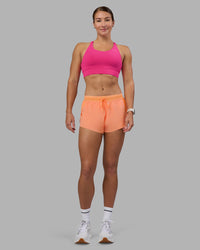 Woman wearing Accelerate Sports Bra - Ultra Pink | Model:Hannah | Size:S