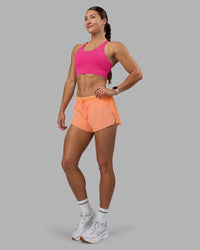 Woman wearing Accelerate Sports Bra - Ultra Pink | Model:Hannah | Size:S