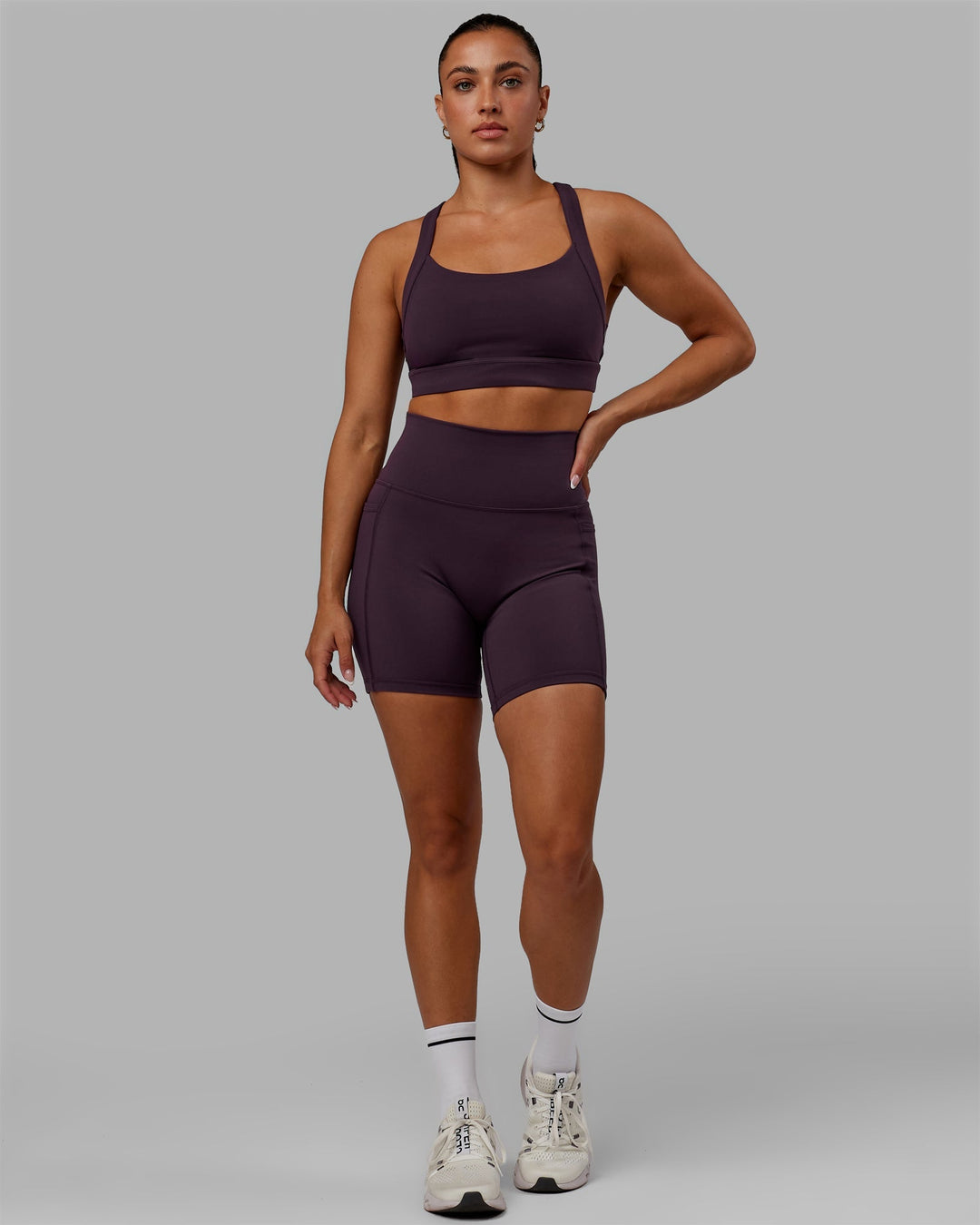 Woman wearing Advance Sports Bra - Midnight Plum