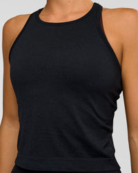 Woman wearing AeroFLX+ Seamless Flow Skimmer Tank - Black Marl | Model:Amity | Size:S