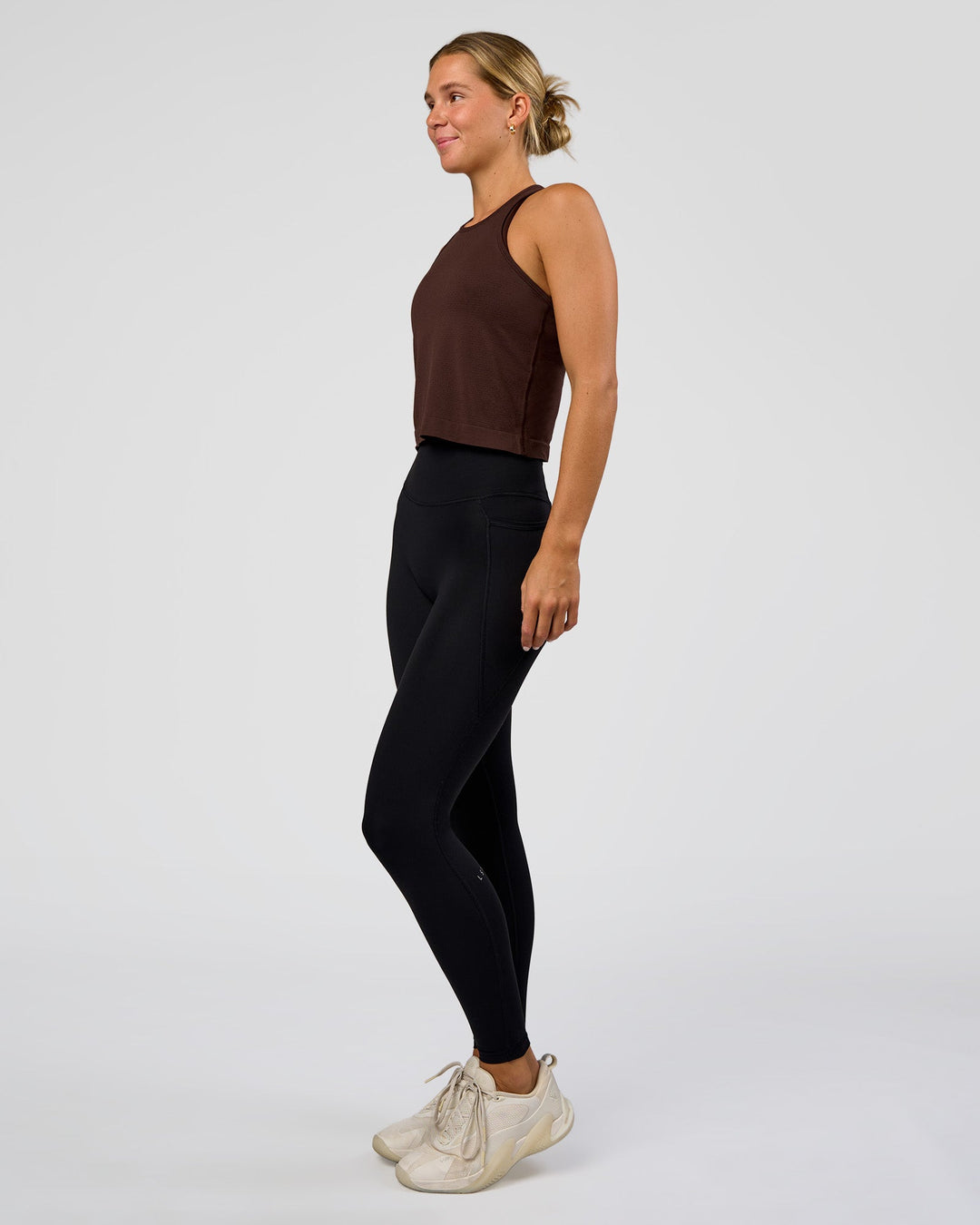 Woman wearing AeroFLX+ Seamless Flow Skimmer Tank - Hot Chocolate/Hot Chocolate | Model:Amity | Size:S