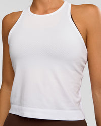 Woman wearing AeroFLX+ Seamless Flow Skimmer Tank - White/White | Model:Amity | Size:S