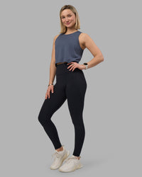 Woman wearing AeroFLX+ Seamless Skimmer Tank - Night Shadow/Night Shadow | Model:Halle | Size:S
